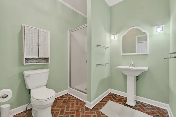 a white toilet sitting next to a shower curtain