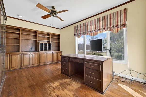 a view of a big room with windows and cabinet