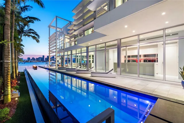 a view of a living room and a balcony