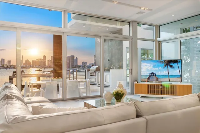 a view of a balcony with a swimming pool and sitting space