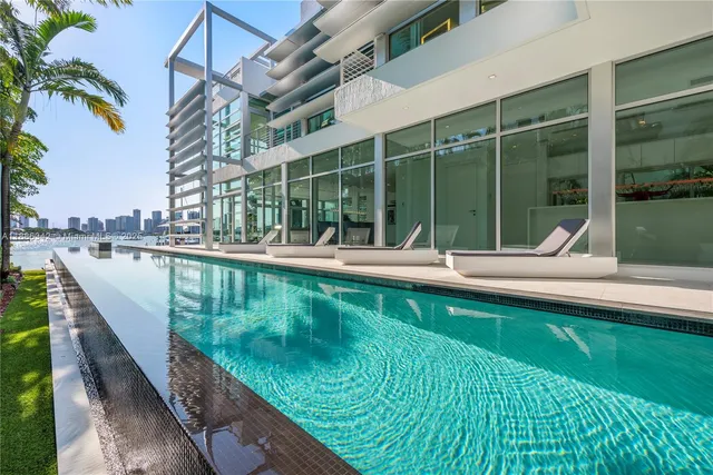 a bedroom with a bed couch and window