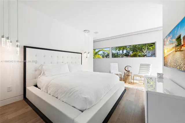 a view of a swimming pool with a patio and a yard