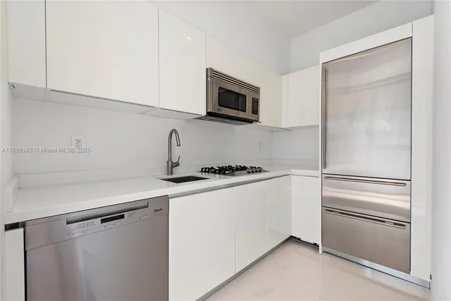 a dining room with furniture and chandelier