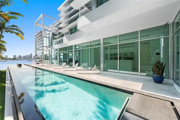 a hallway with a large window and cars