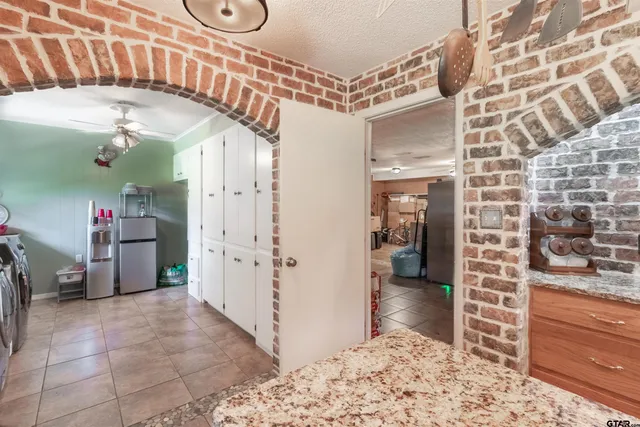 a view of a hallway and dining room