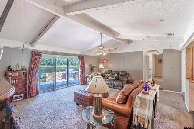 a room with furniture and a large window