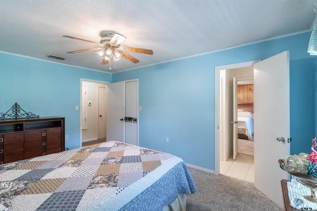 a bedroom with a bed and a dresser