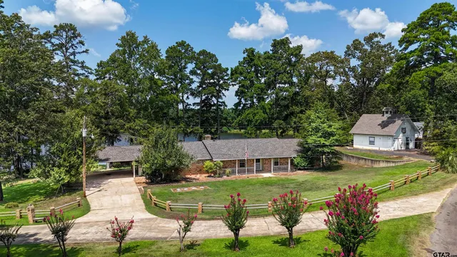 a aerial view of a house with swimming pool and garden