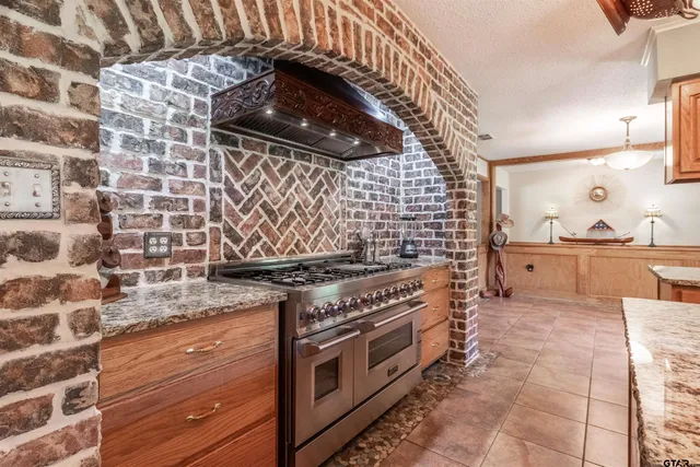 a kitchen with a stove and a sink