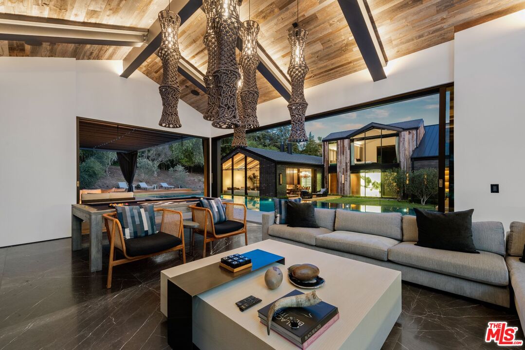 24350 Bridle Trail Road Hidden Hills, CA 91302 - Photo 18 of 23 a living room with furniture and a large window