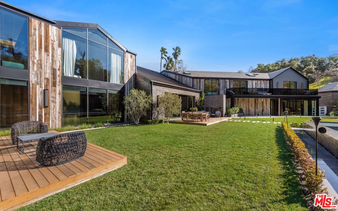24350 Bridle Trail Road Hidden Hills, CA 91302 - Photo 3 of 23 a view of a house with swimming pool and porch