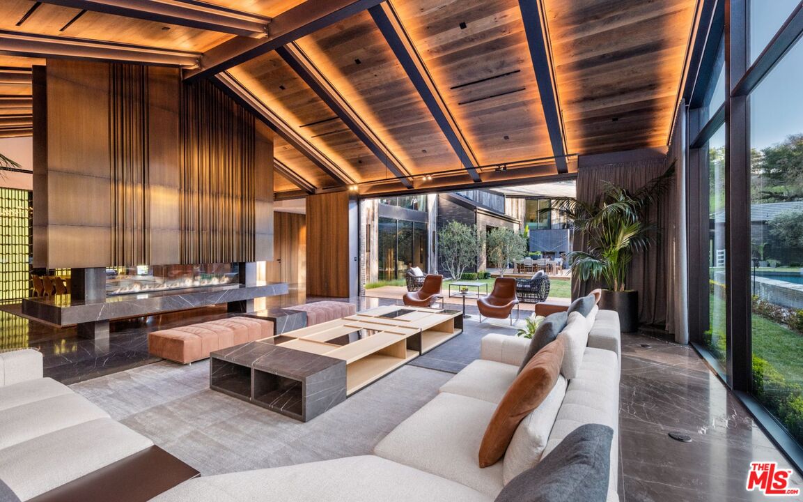 24350 Bridle Trail Road Hidden Hills, CA 91302 - Photo 5 of 23 a living room with furniture and a large window