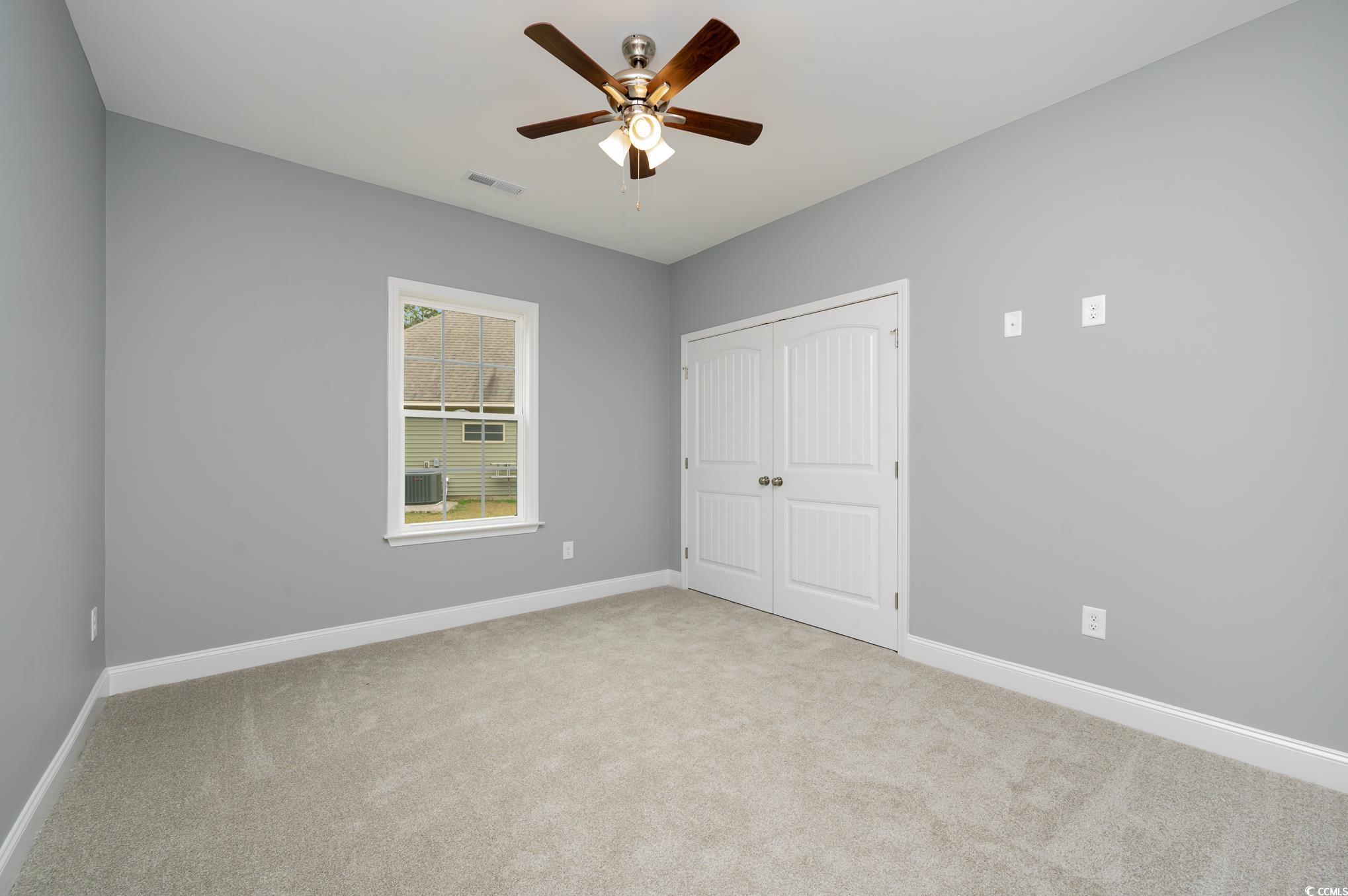 357 Log Cabin Road Loris, SC 29569 - Photo 11 of 27 Unfurnished bedroom featuring ceiling fan, light c