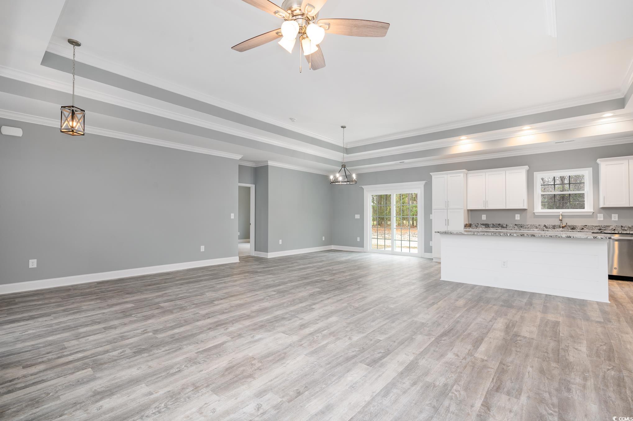 357 Log Cabin Road Loris, SC 29569 - Photo 4 of 27 Unfurnished living room featuring ceiling fan, lig
