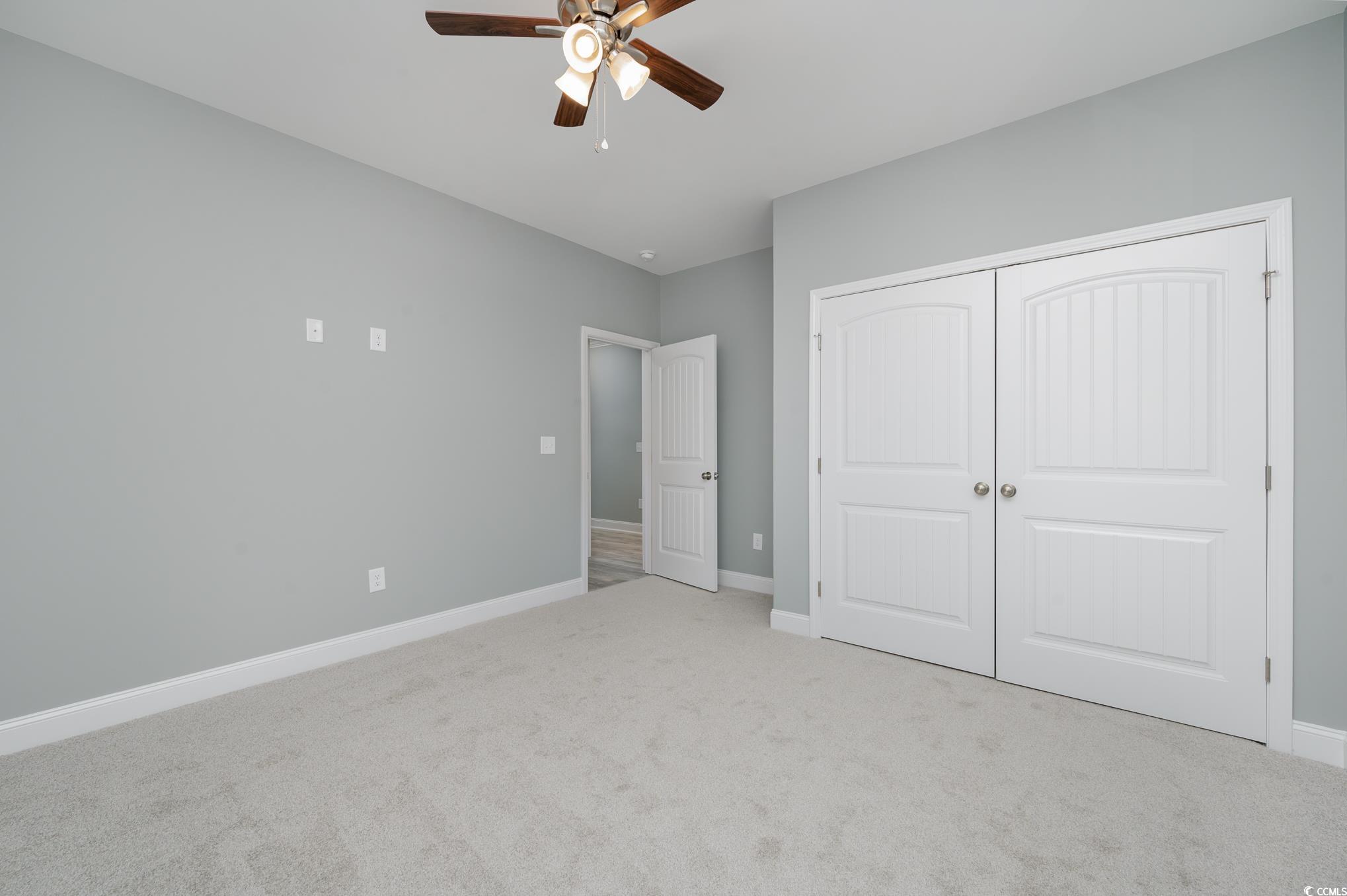 357 Log Cabin Road Loris, SC 29569 - Photo 10 of 27 Unfurnished bedroom featuring ceiling fan, a close