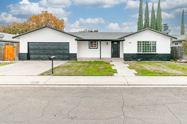 a view of front of a house with a patio