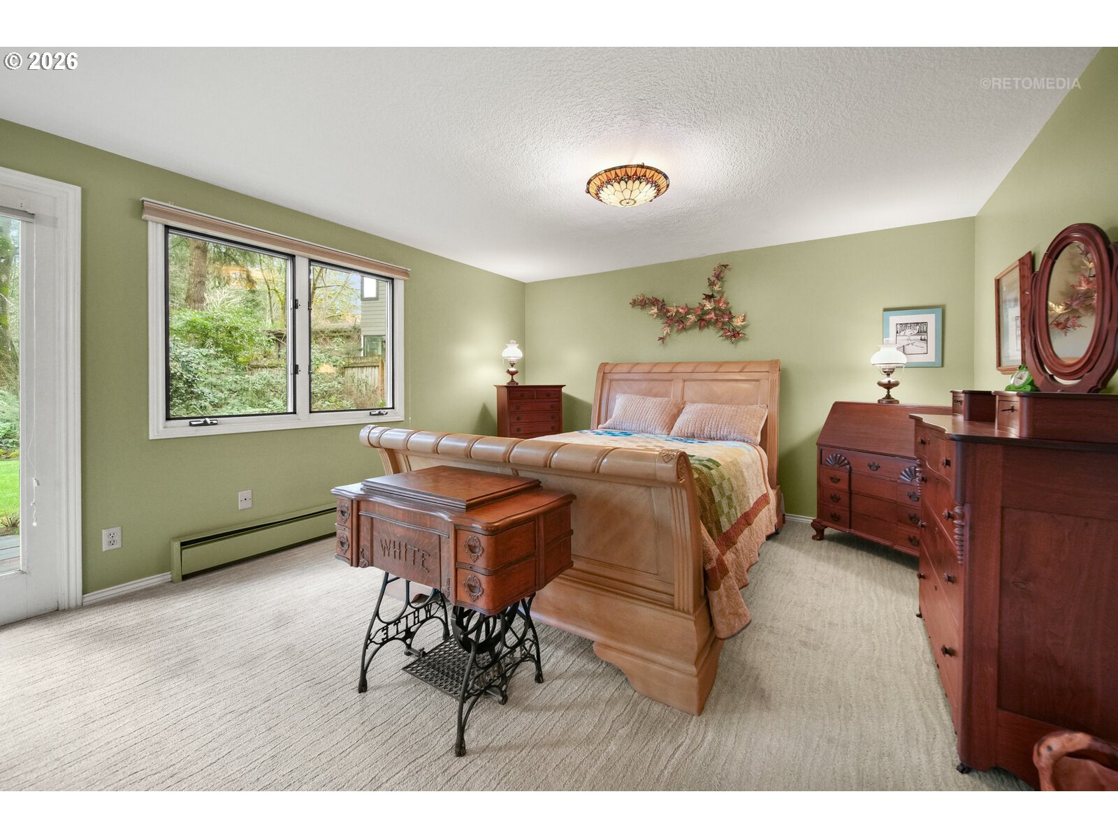 17738 Kelok Road Lake Oswego, OR 97034 - Photo 13 of 48 a bed room with a bed and a tv