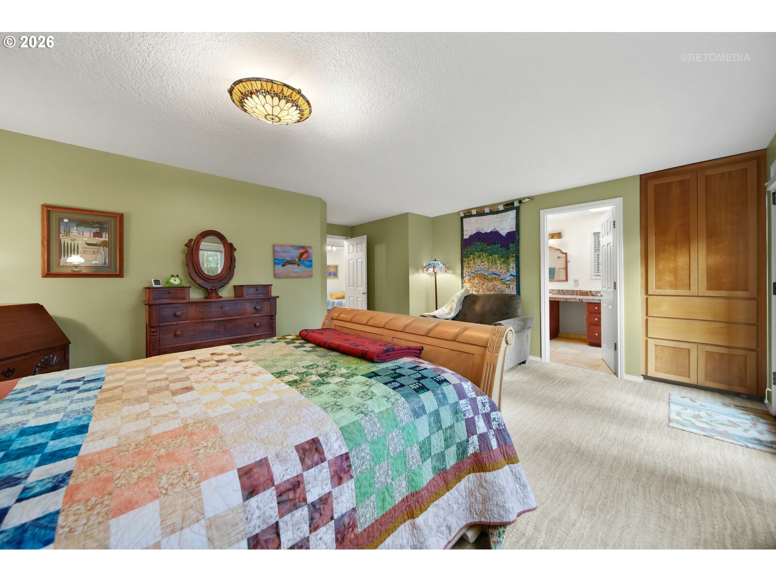 17738 Kelok Road Lake Oswego, OR 97034 - Photo 14 of 48 a bedroom with a bed and a dresser