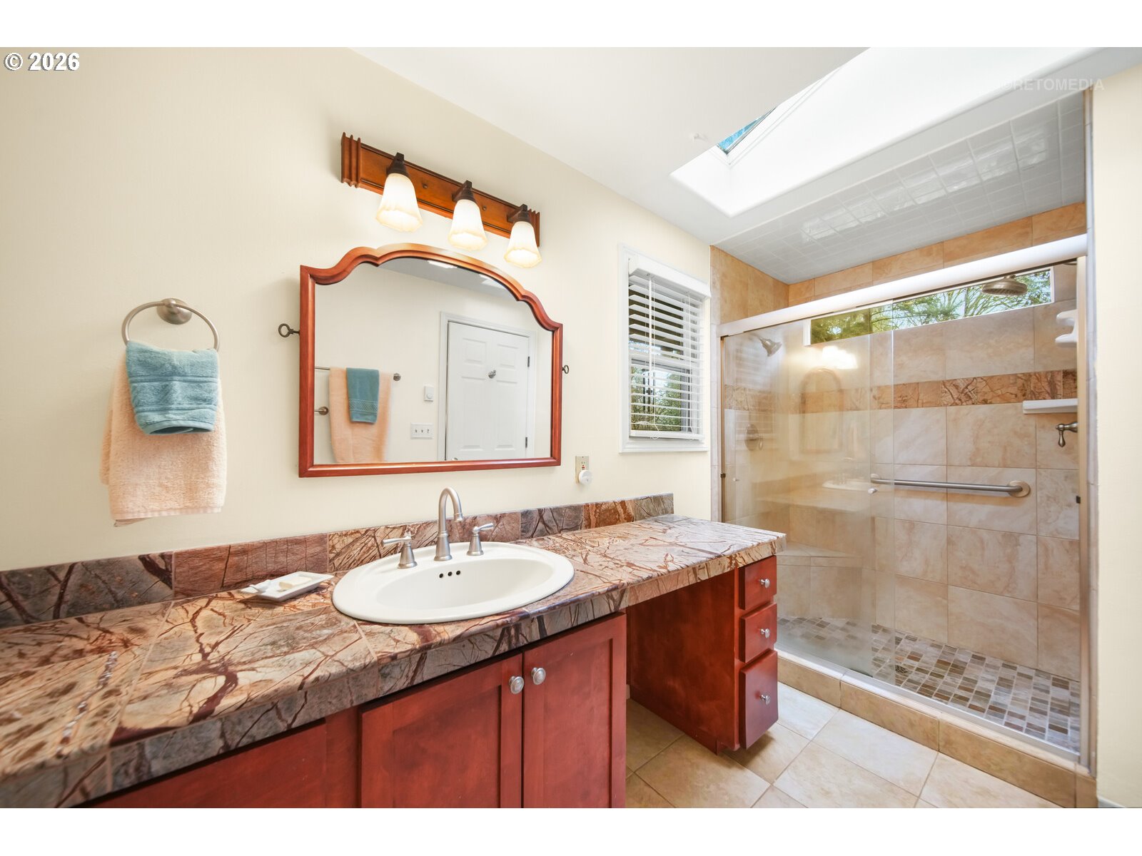 17738 Kelok Road Lake Oswego, OR 97034 - Photo 15 of 48 a bathroom with a sink and a mirror