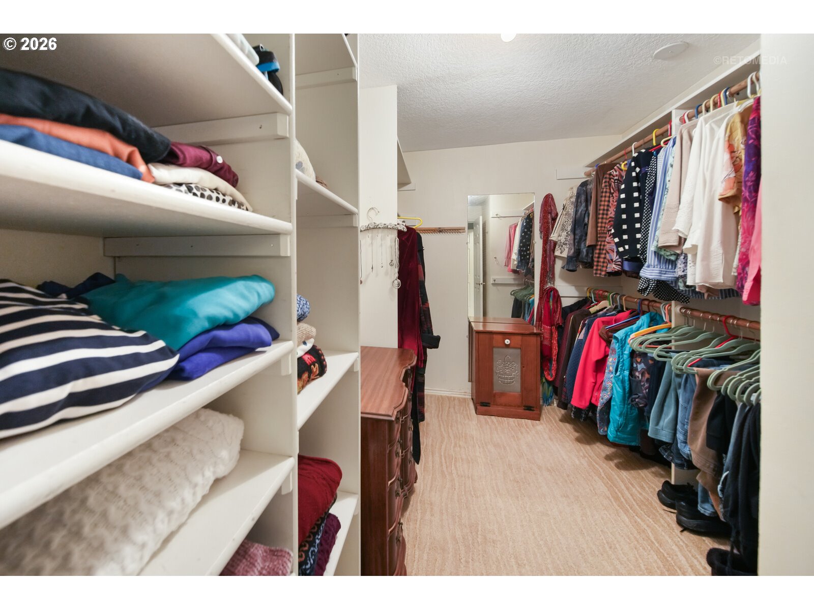 17738 Kelok Road Lake Oswego, OR 97034 - Photo 16 of 48 a view of walk in closet with clothes and shoes