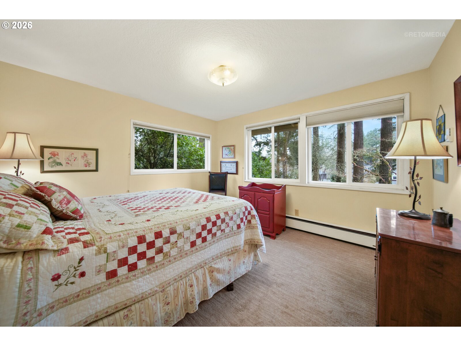 17738 Kelok Road Lake Oswego, OR 97034 - Photo 17 of 48 a bedroom with a large bed and a large window