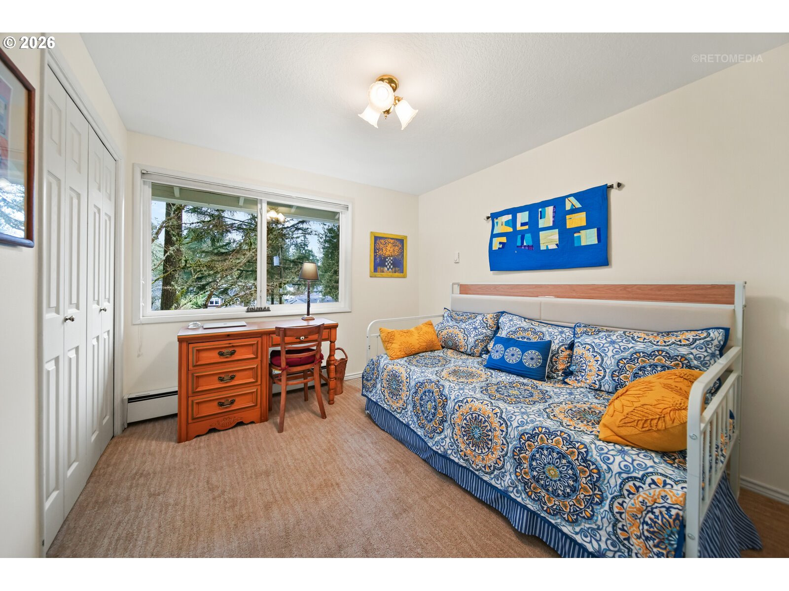 17738 Kelok Road Lake Oswego, OR 97034 - Photo 19 of 48 a bedroom with furniture and a window