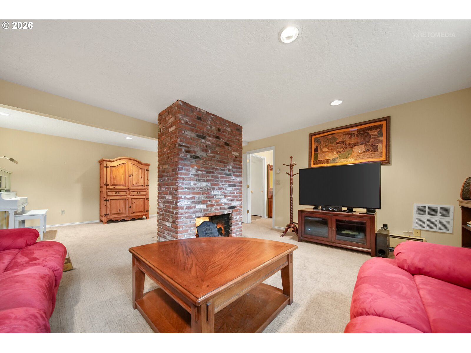 17738 Kelok Road Lake Oswego, OR 97034 - Photo 24 of 48 a living room with furniture and a flat screen tv