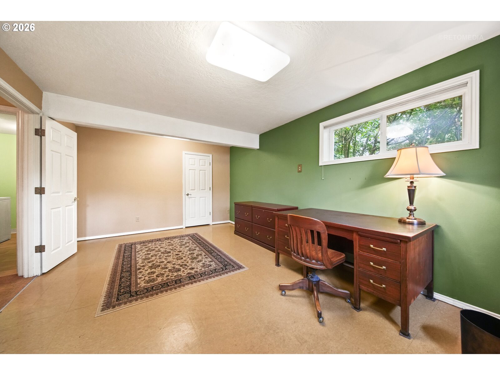 17738 Kelok Road Lake Oswego, OR 97034 - Photo 28 of 48 a bedroom with a bed and a table in it