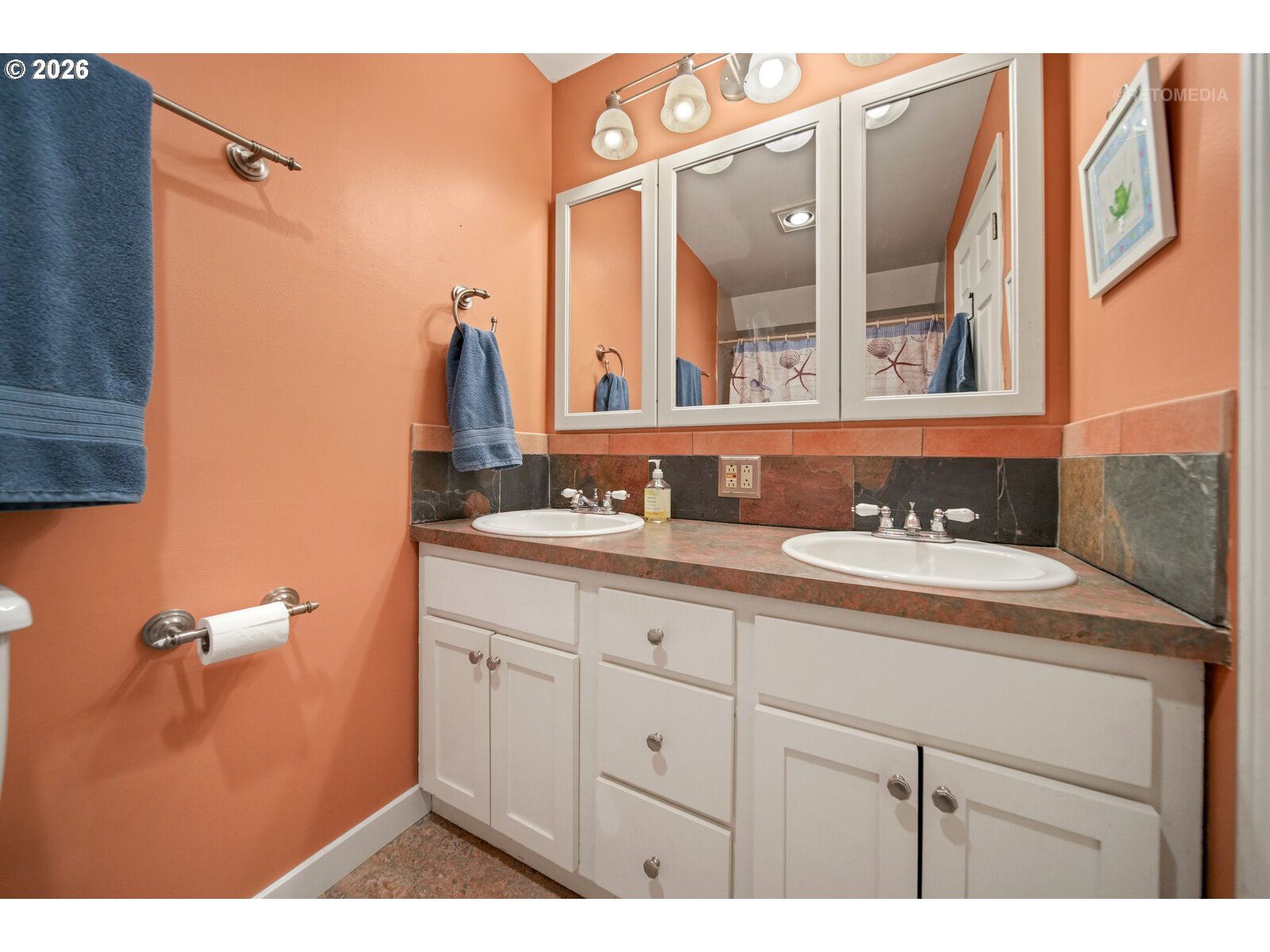 17738 Kelok Road Lake Oswego, OR 97034 - Photo 31 of 48 a bathroom with a sink and a mirror