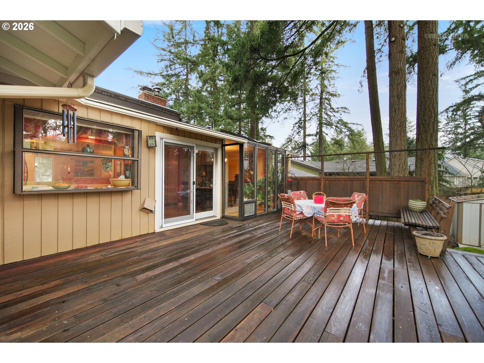17738 Kelok Road Lake Oswego, OR 97034 - Photo 38 of 48 a view of a chairs and table on the wooden deck