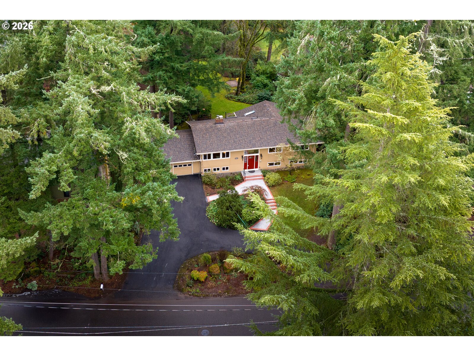 17738 Kelok Road Lake Oswego, OR 97034 - Photo 44 of 48 a view of a house with a yard