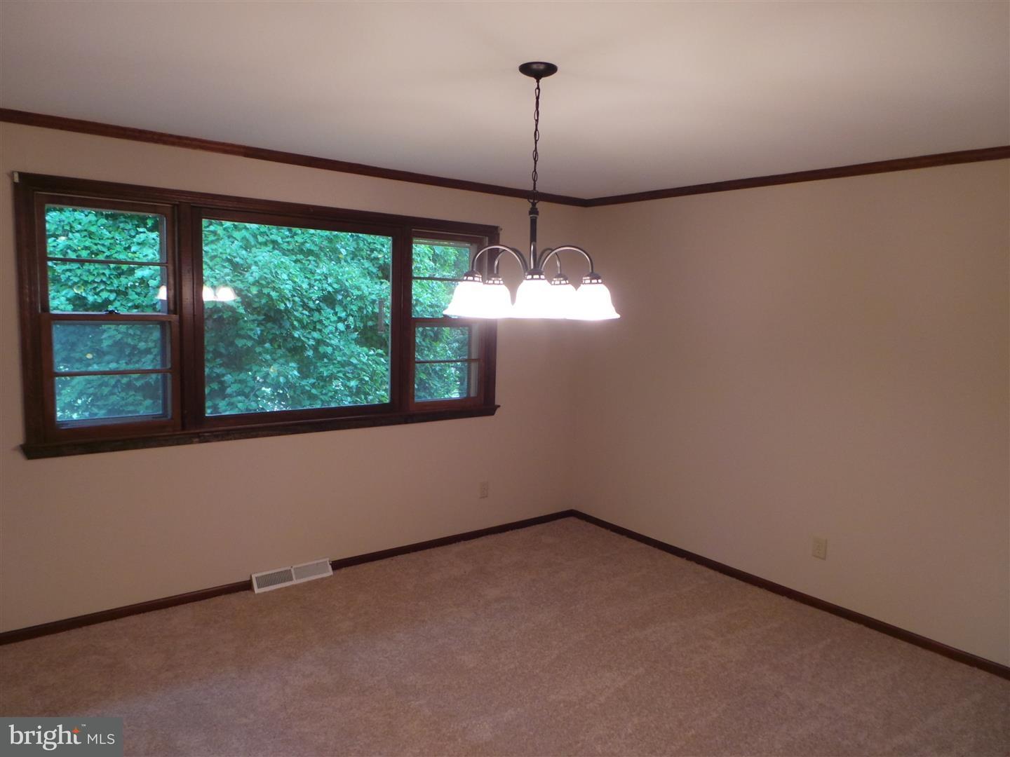1711 Prospect Ridge Boulevard Haddon Heights, NJ 08035 - Photo 11 of 24 a view of an empty room with windows and ceiling fan