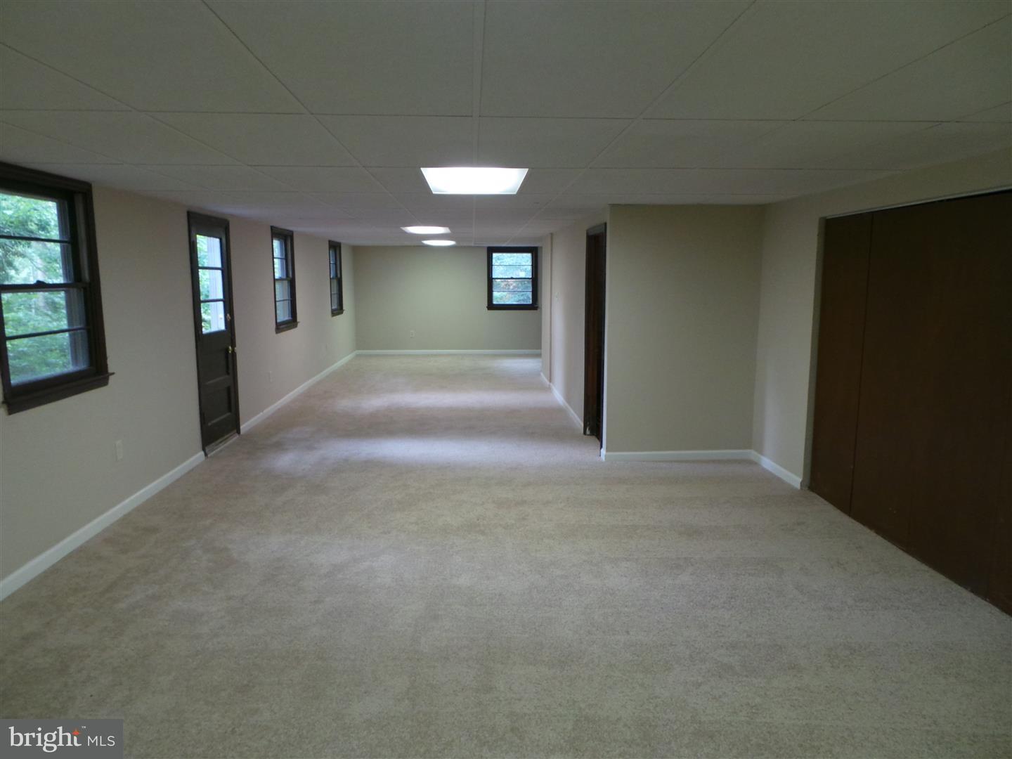 1711 Prospect Ridge Boulevard Haddon Heights, NJ 08035 - Photo 23 of 24 a view of a hallway with wooden shelves and door