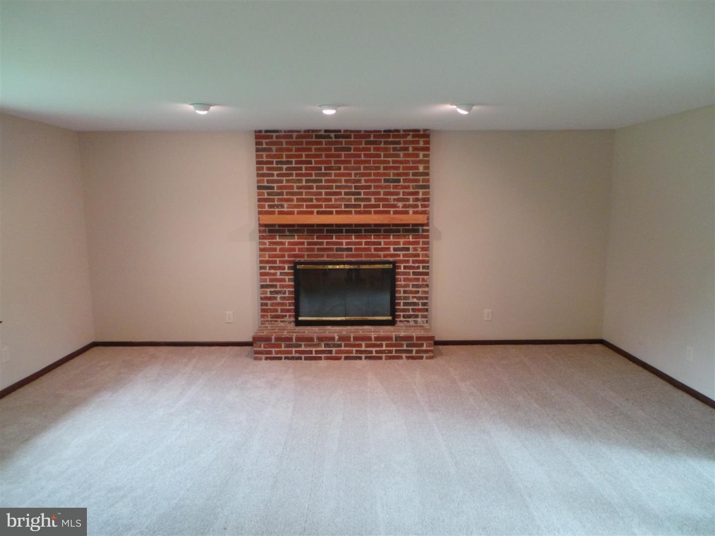 1711 Prospect Ridge Boulevard Haddon Heights, NJ 08035 - Photo 4 of 24 a view of an empty room with a fireplace and a window