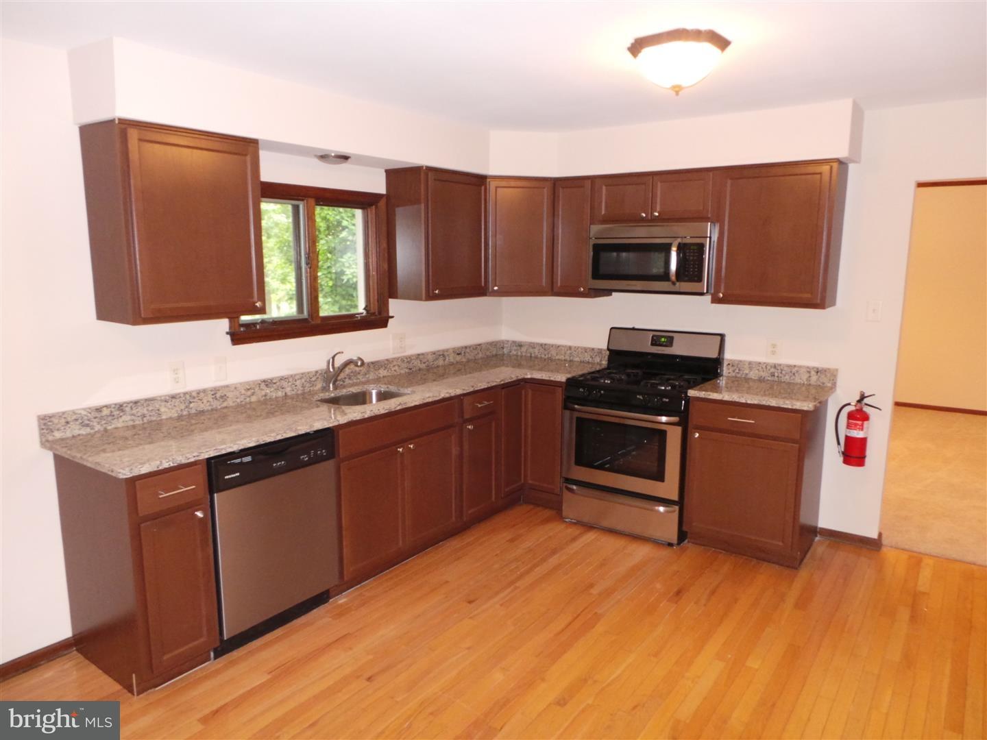 1711 Prospect Ridge Boulevard Haddon Heights, NJ 08035 - Photo 8 of 24 a kitchen with stainless steel appliances granite countertop a stove a sink and a microwave
