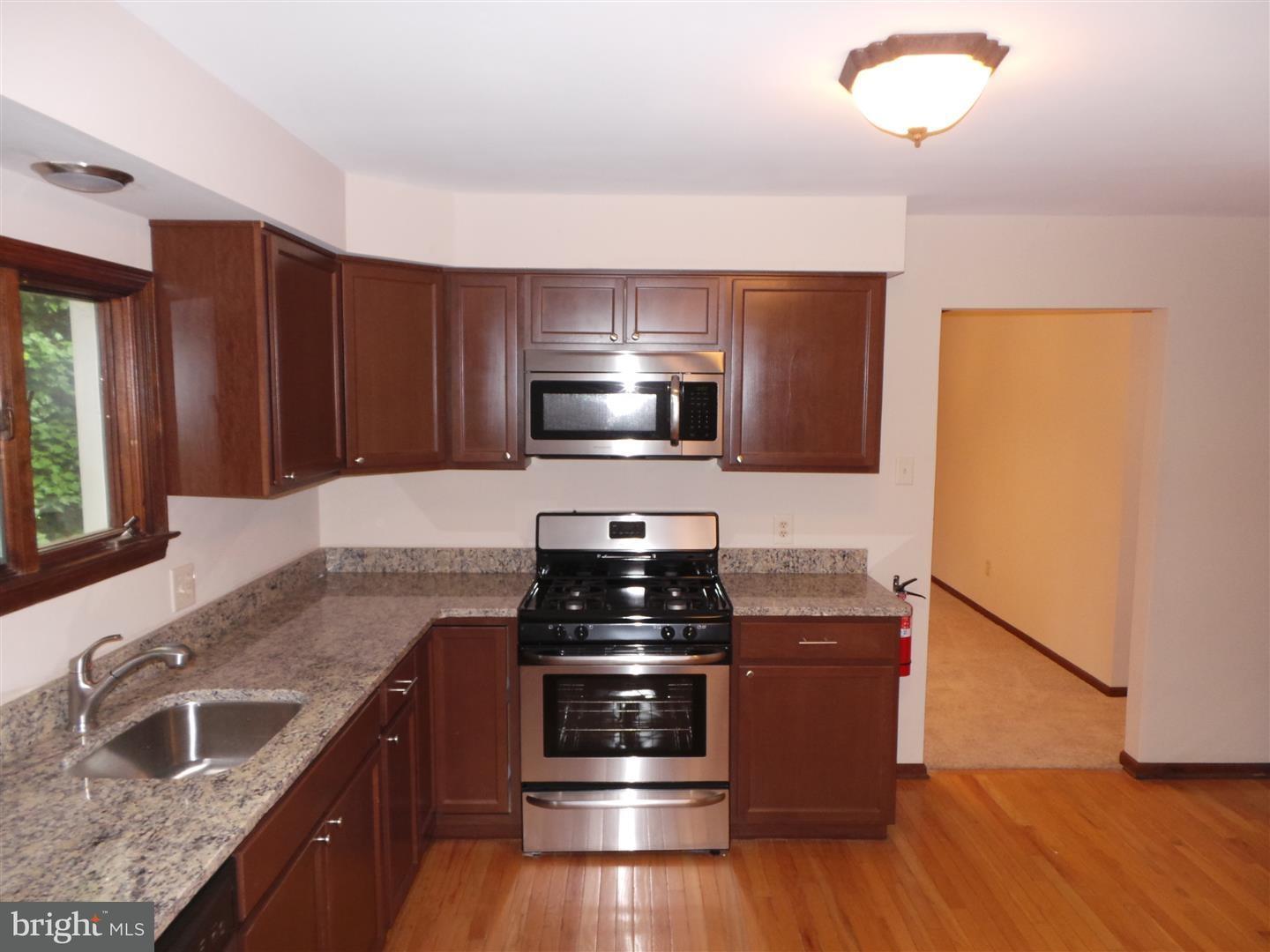 1711 Prospect Ridge Boulevard Haddon Heights, NJ 08035 - Photo 9 of 24 a kitchen with granite countertop a stove and a sink