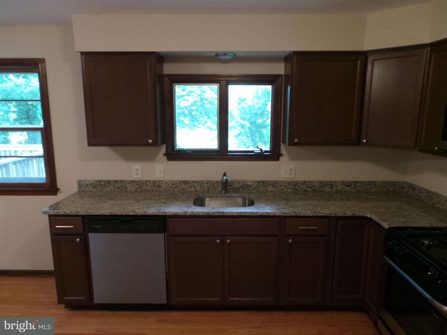 1711 Prospect Ridge Boulevard Haddon Heights, NJ 08035 - Photo 10 of 24 a kitchen with a sink a window and cabinets
