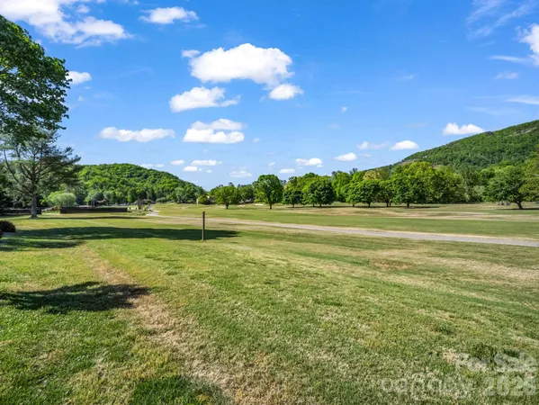 a view of a golf course with a lake