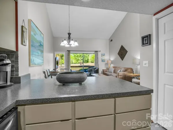 a kitchen with a sink a counter space and a window