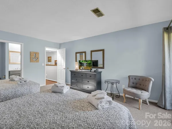 a bedroom with furniture and a window