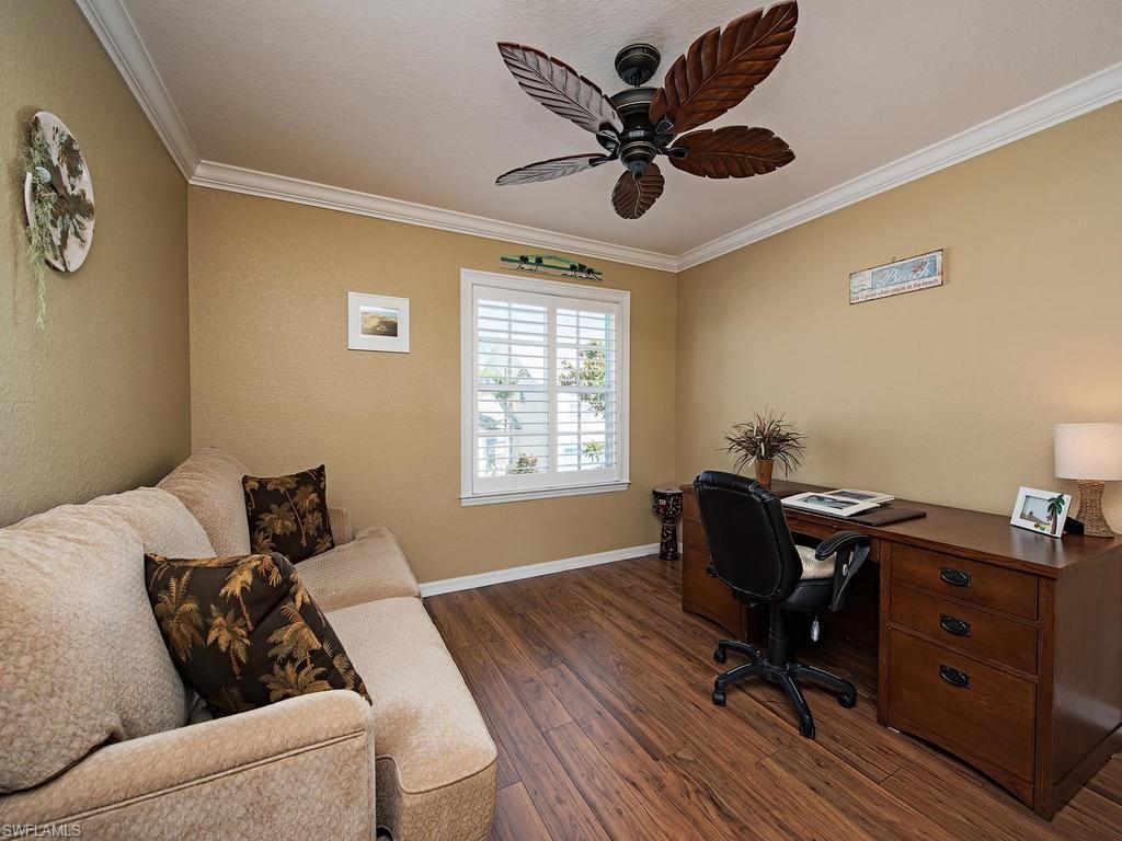 1095 Partridge Circle, Unit 201 Naples, FL 34104 - Photo 9 of 12 a living room with furniture and a window