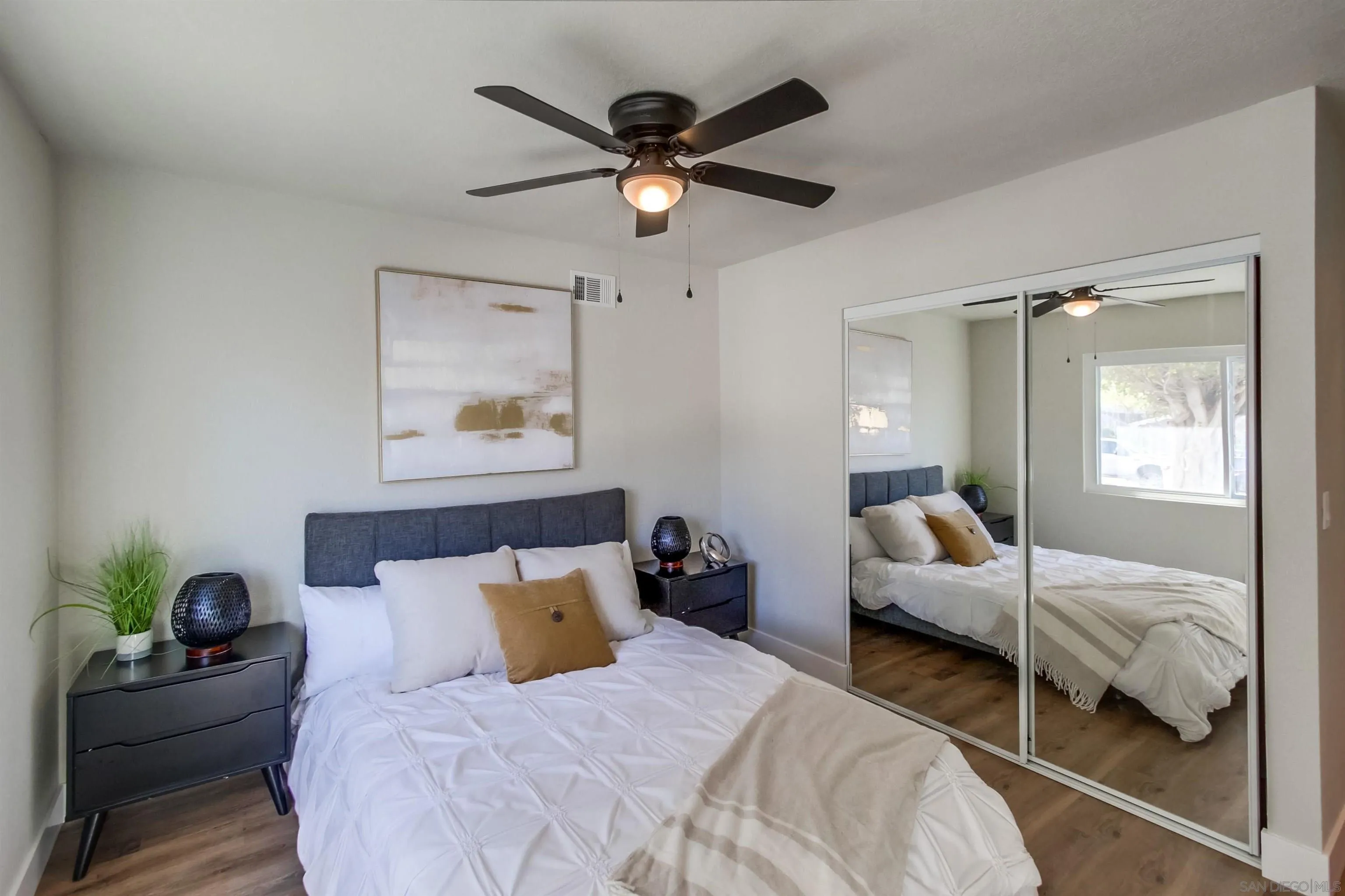 238 69th Street San Diego, CA 92114 - Photo 11 of 27 a bedroom with bed and window