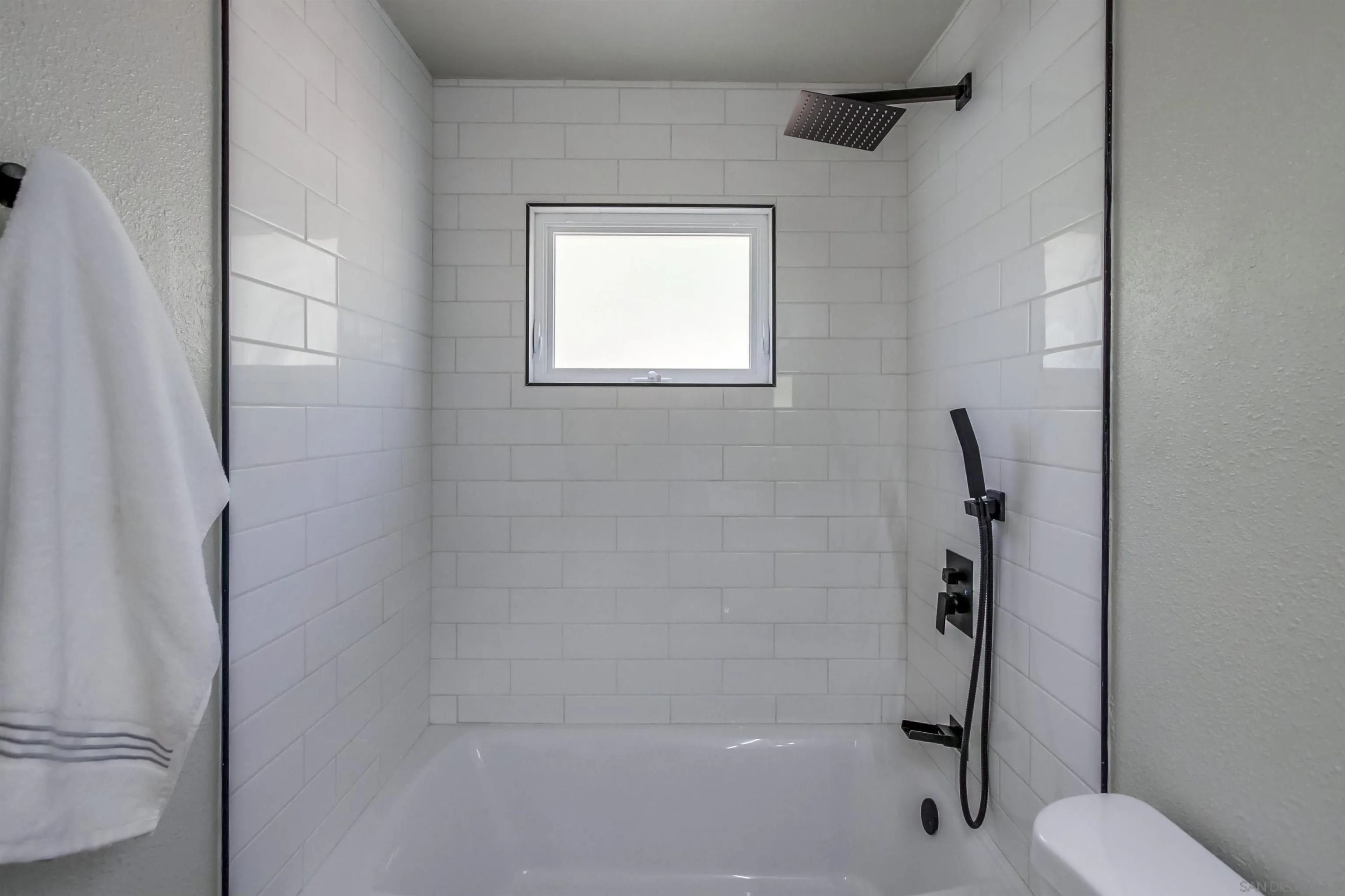 238 69th Street San Diego, CA 92114 - Photo 15 of 27 a bathroom with a shower and a toilet