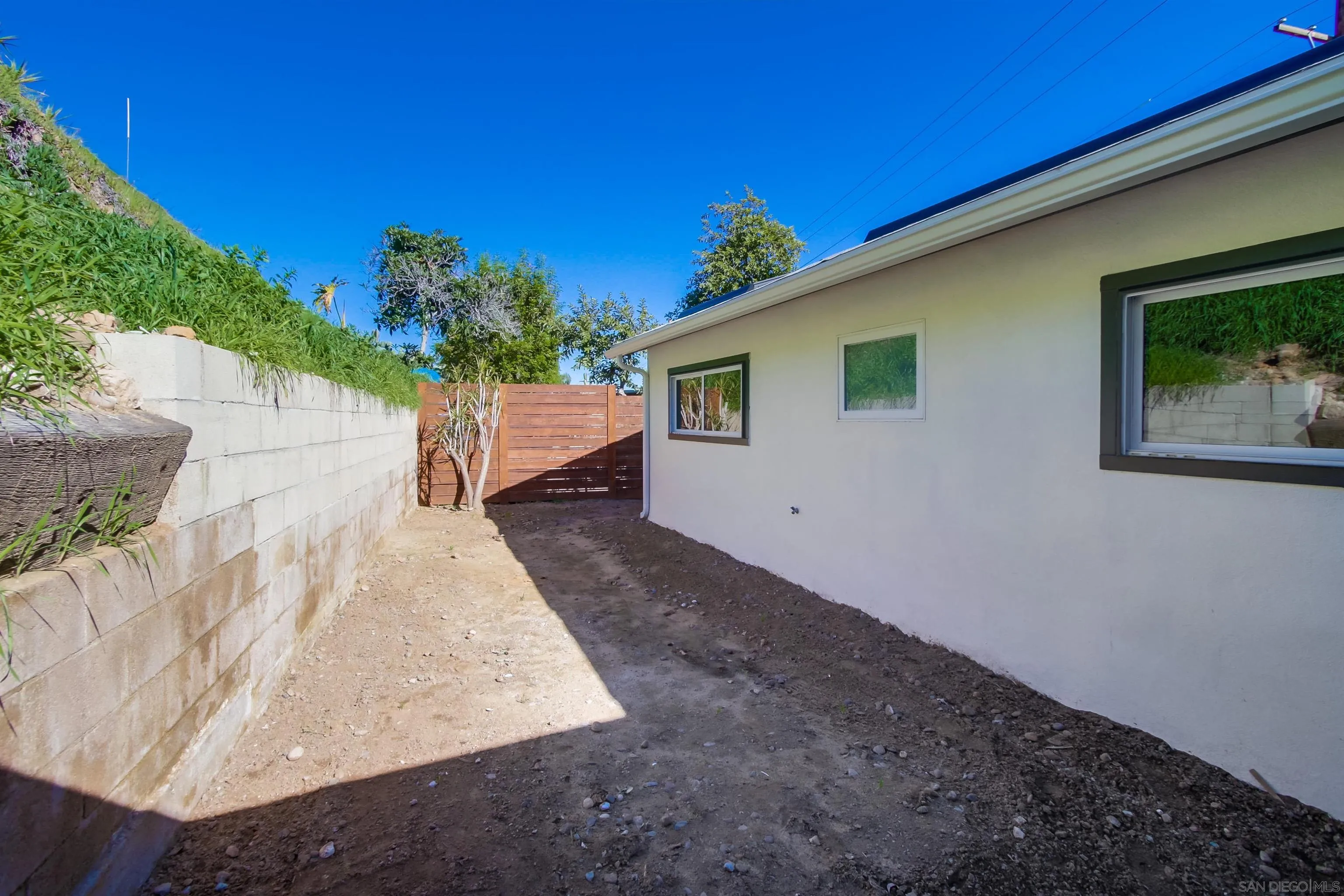 238 69th Street San Diego, CA 92114 - Photo 27 of 27 a backyard of a house with outdoor seating