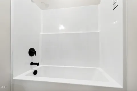 a view of room with a ceiling fan