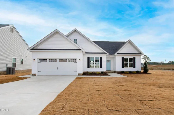 a view of a house with a big yard