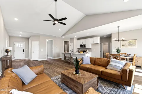 a living room with furniture fireplace and flat screen tv