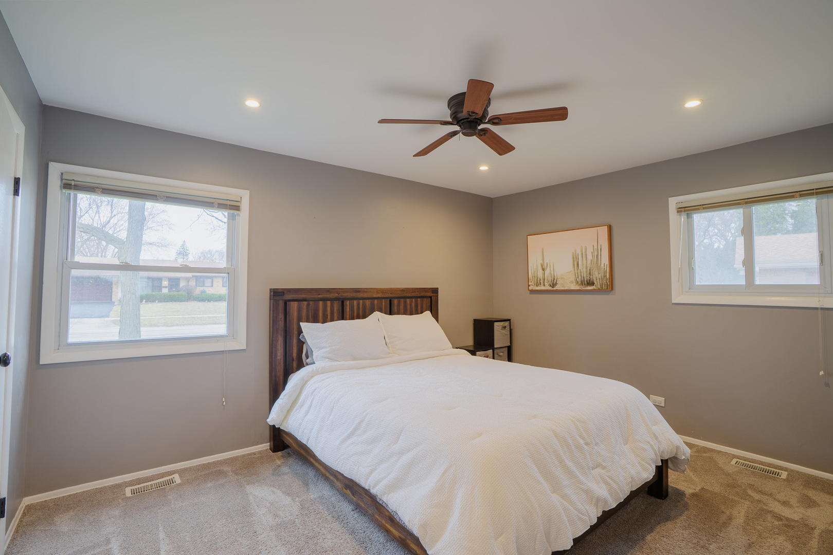 1935 Larchmont Road Hoffman Estates, IL 60169 - Photo 15 of 30 a bedroom with a large bed and a window