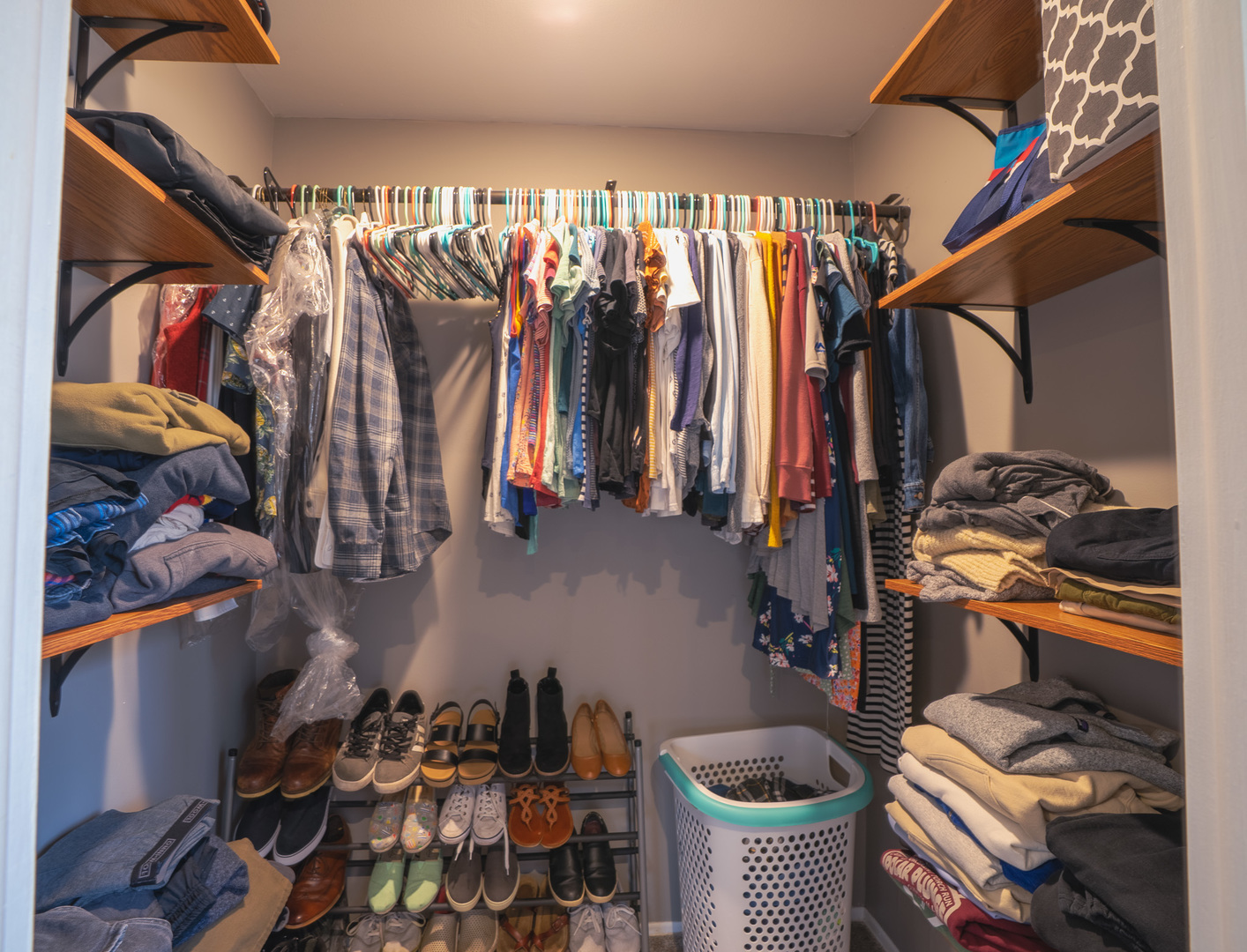 1935 Larchmont Road Hoffman Estates, IL 60169 - Photo 17 of 30 a view of walk in closet with clothes and shoes