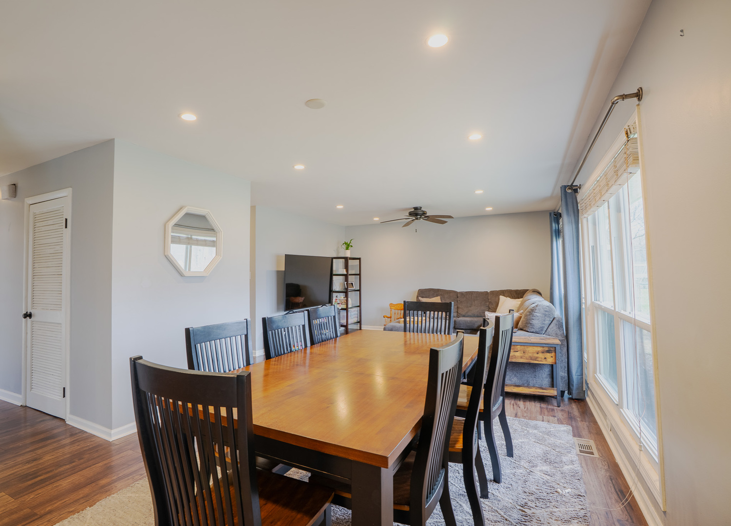 1935 Larchmont Road Hoffman Estates, IL 60169 - Photo 6 of 30 a view of a dining room with furniture a chandelier and wooden floor